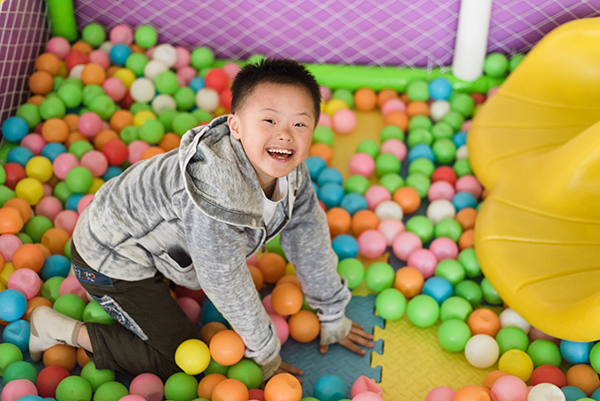 brody smiles in ball pit