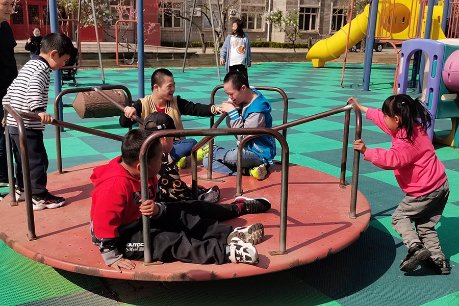 children enjoying the merry-go-round