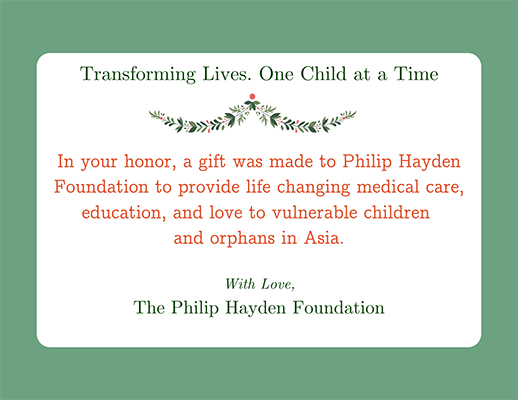 interior text of card edged in green: Transforming lives one child at a time. In your honor, a gift has been made to PHF