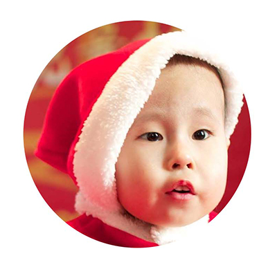 Chinese toddler in Santa hat