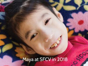 young Chinese girl with CP smiles