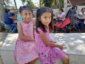 two Mexican girls enjoying a Children's Day celebration