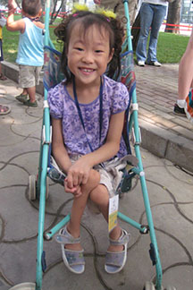 young chinese girl in stroller