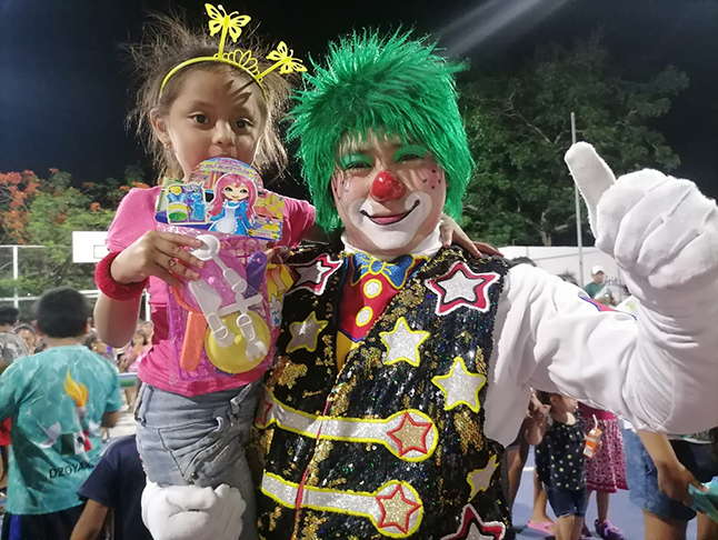 child with clown at children's day festival in Mexico